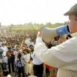 Prime Minister Muhammad Nawaz Sharif addressing a public gathering in the rain and flood affected areas of Chiniot on September 12, 2014